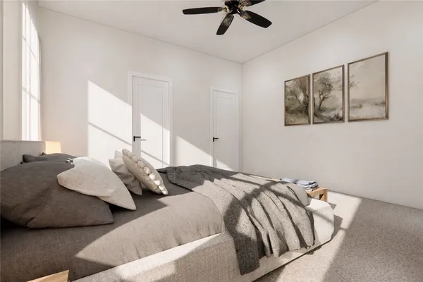 a bedroom with bed and the view of bathroom
