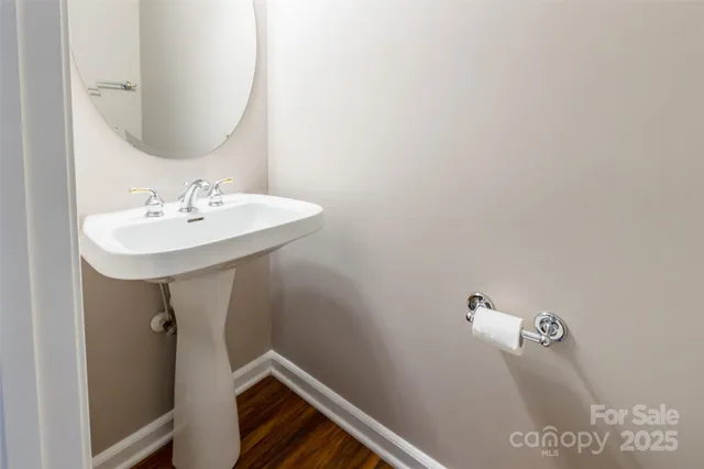a bathroom with a sink and mirror