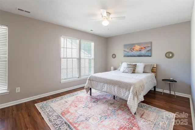 a spacious bedroom with a large bed and a window