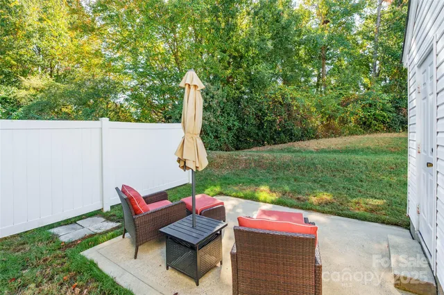 a view of a backyard with sitting area