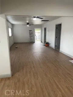 a view of a hallway view with wooden floor and staircase