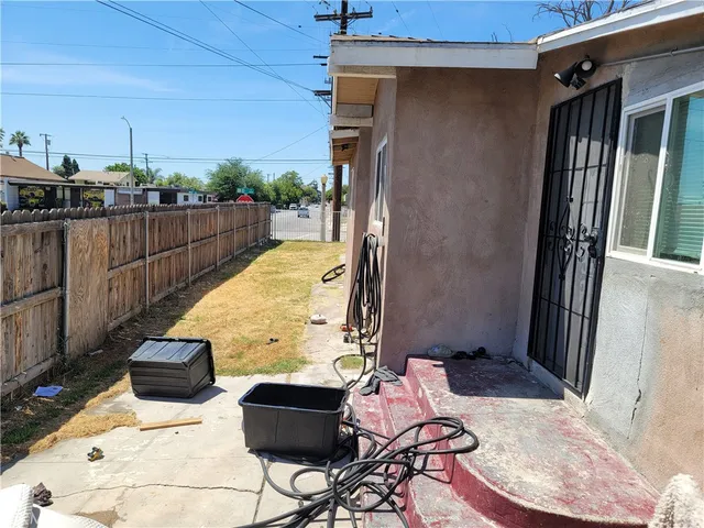 a view of balcony with wooden floor and seating space