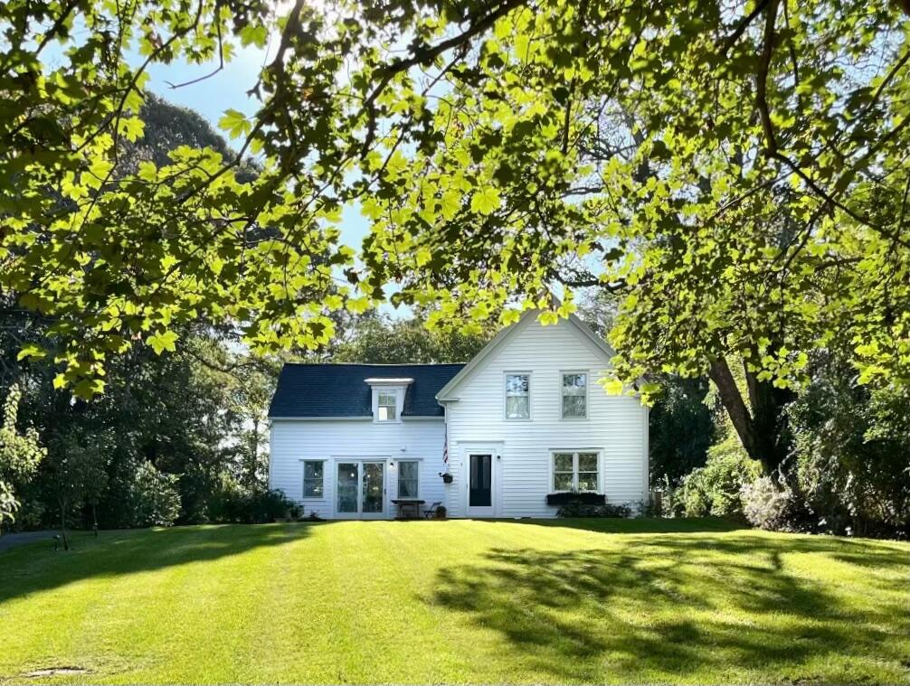 9 Locust Road Orleans, MA 02653 - Photo 1 of 41 a front view of a house with a yard