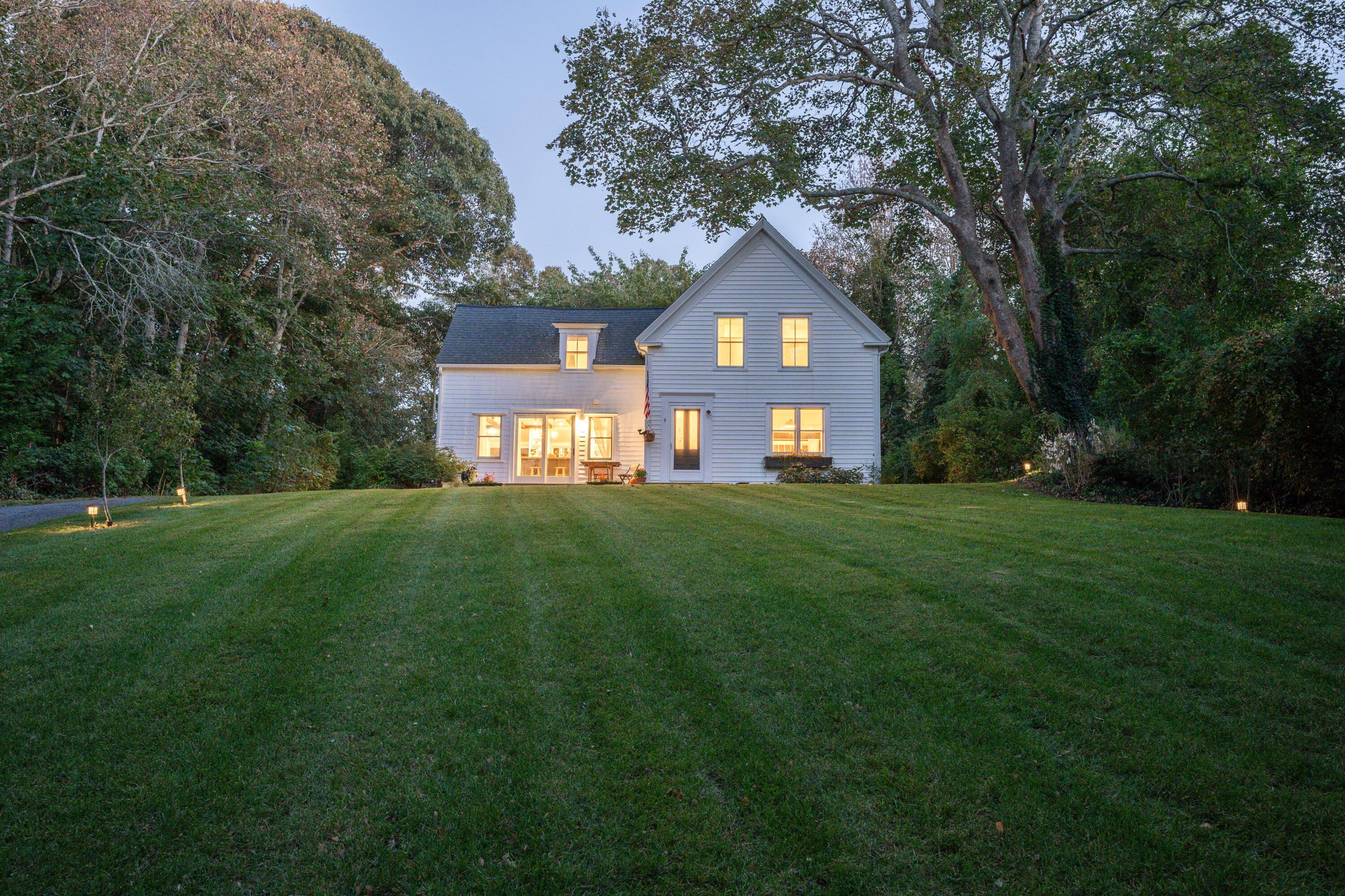 9 Locust Road Orleans, MA 02653 - Photo 2 of 41 a front view of a house with a yard