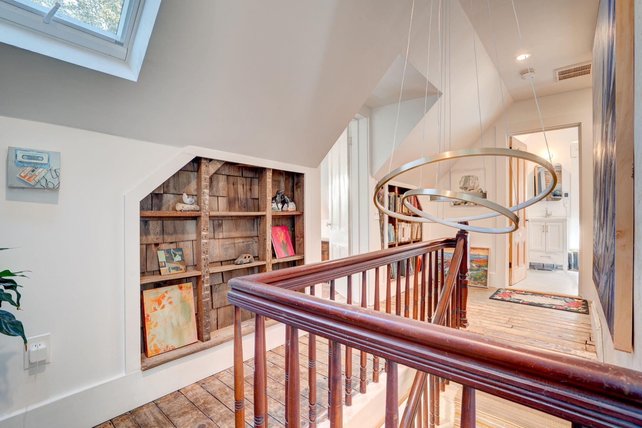 9 Locust Road Orleans, MA 02653 - Photo 23 of 41 a view of staircase with large window and wooden floor