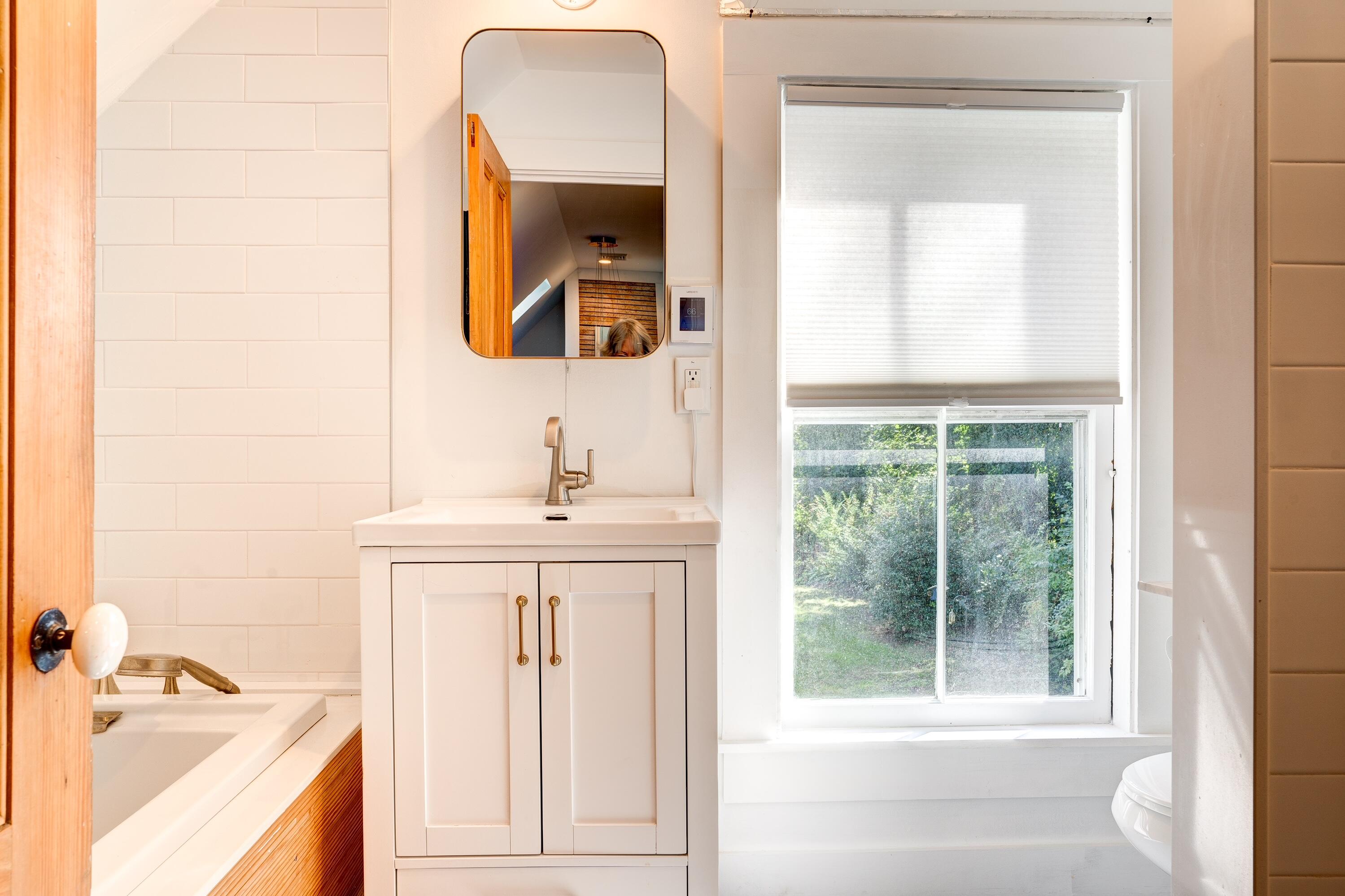 9 Locust Road Orleans, MA 02653 - Photo 32 of 41 a bathroom with a sink and a mirror