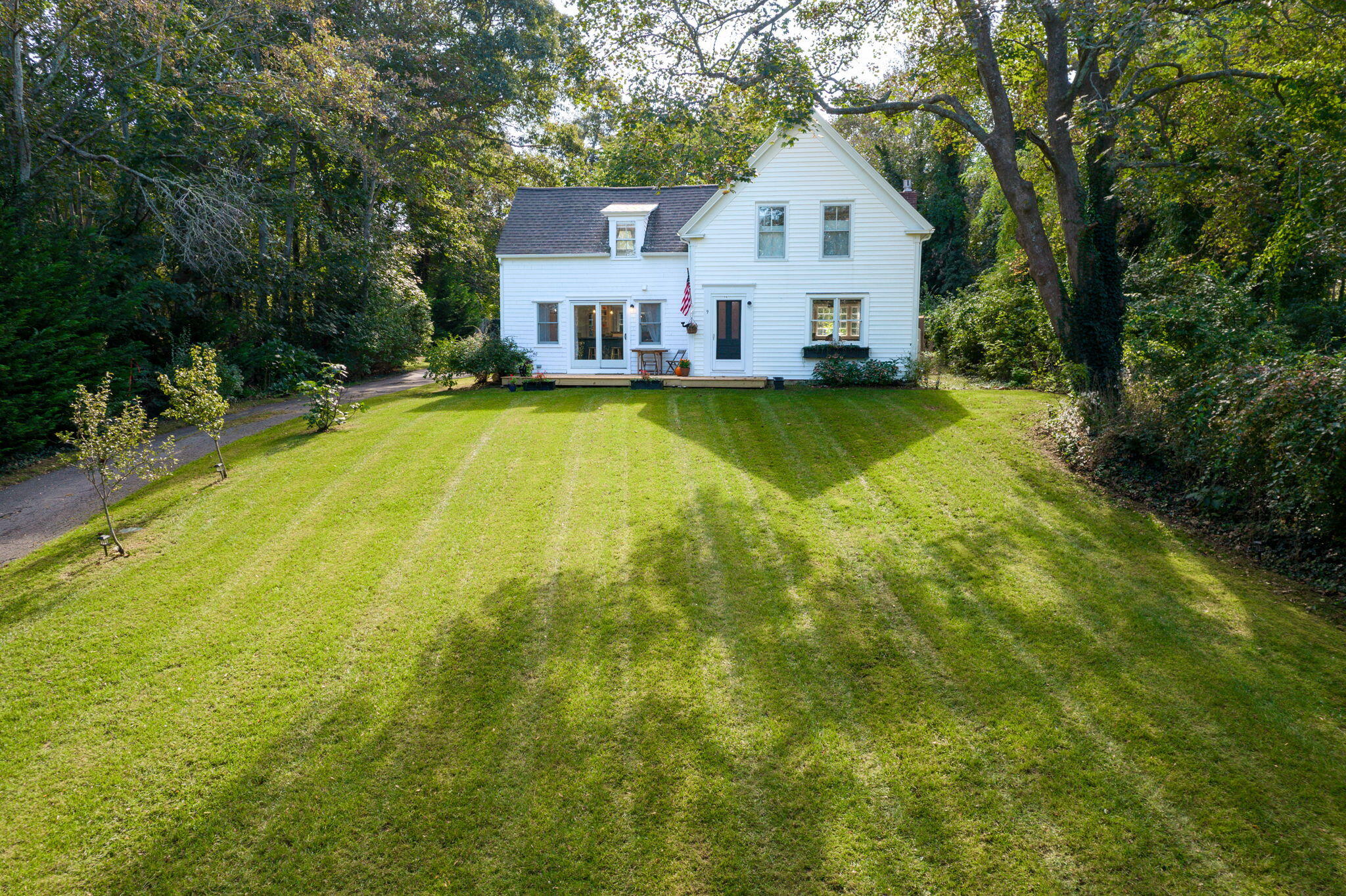 9 Locust Road Orleans, MA 02653 - Photo 36 of 41 a view of a house with pool and a yard