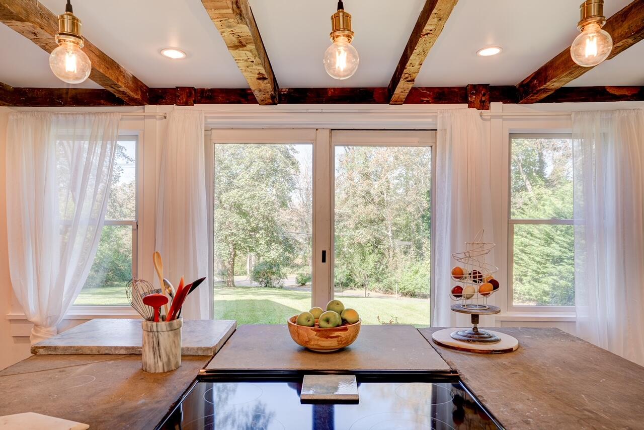 9 Locust Road Orleans, MA 02653 - Photo 5 of 41 a view of a dining room with furniture window and outside view