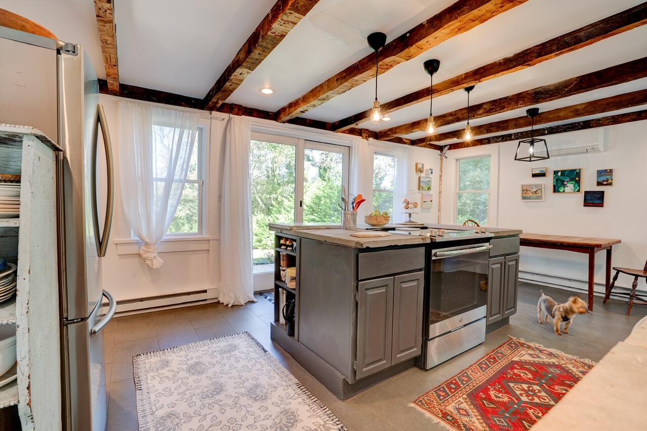 9 Locust Road Orleans, MA 02653 - Photo 7 of 41 a kitchen with stainless steel appliances granite countertop a refrigerator and a stove