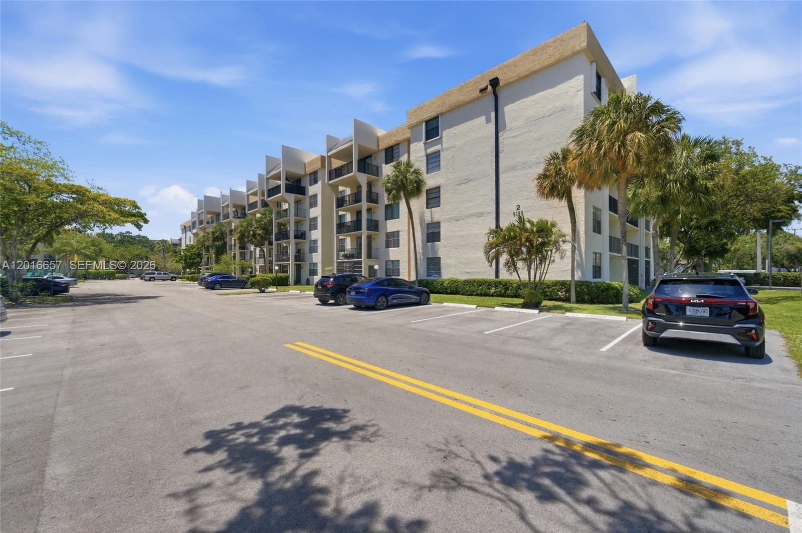 6195 Rock Island Road, Unit 511 Tamarac, FL 33319 - Photo 11 of 31 a car parked on the side of the road