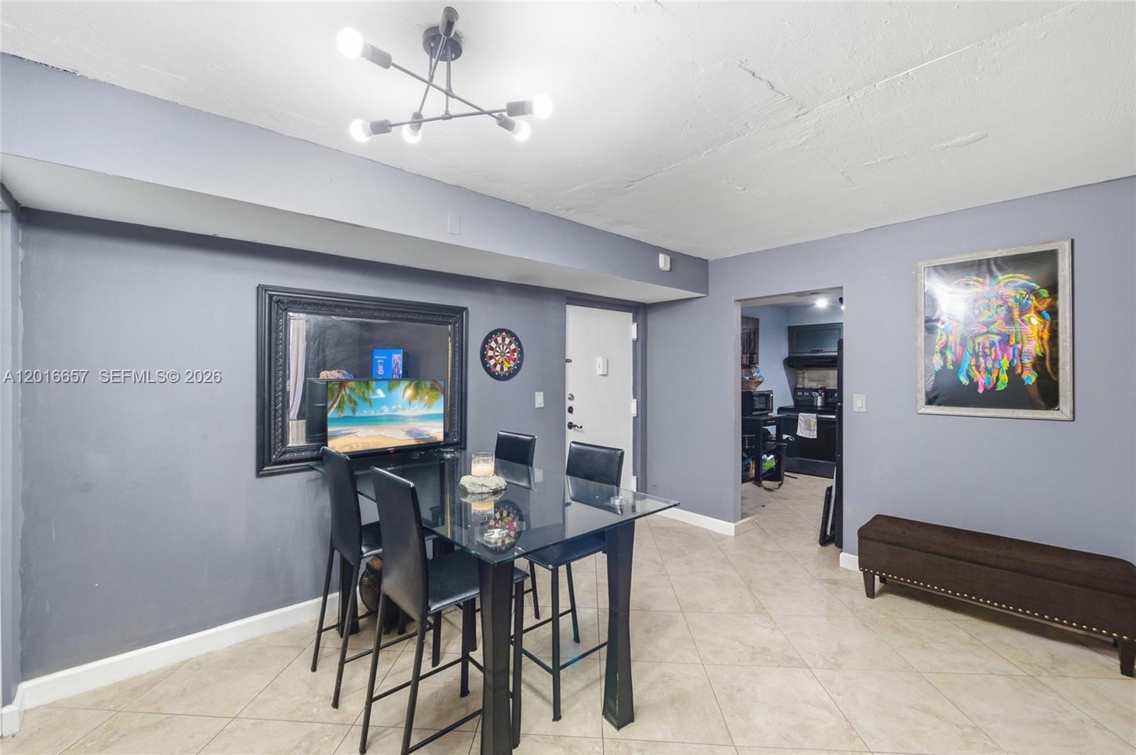 6195 Rock Island Road, Unit 511 Tamarac, FL 33319 - Photo 13 of 31 a view of a dining room with furniture