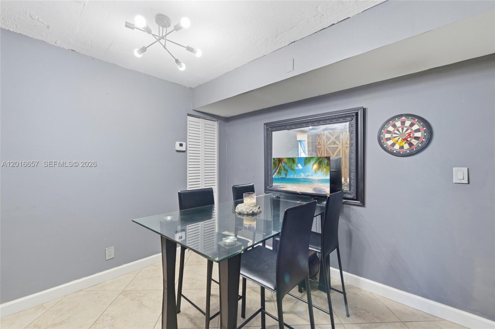 6195 Rock Island Road, Unit 511 Tamarac, FL 33319 - Photo 15 of 31 a view of a dining room with furniture and a window