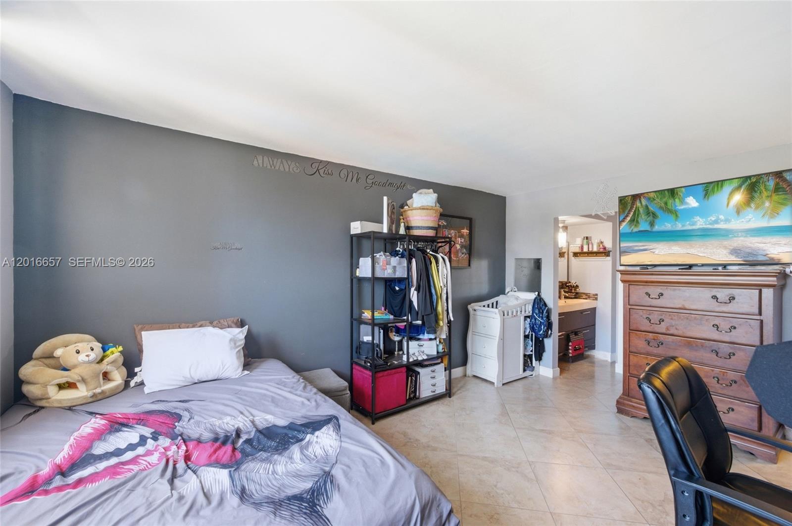 6195 Rock Island Road, Unit 511 Tamarac, FL 33319 - Photo 20 of 31 a bedroom with bed and a storage