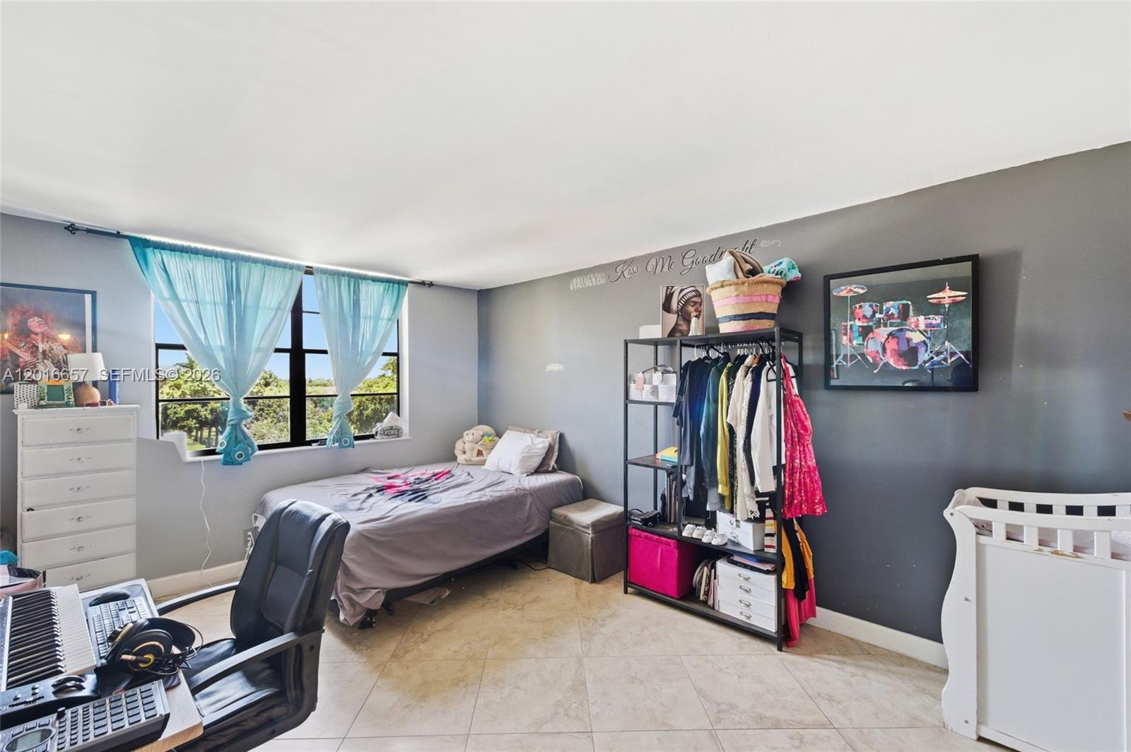 6195 Rock Island Road, Unit 511 Tamarac, FL 33319 - Photo 21 of 31 a bed room with a bed and a window