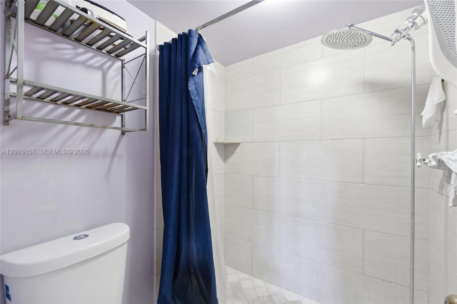 6195 Rock Island Road, Unit 511 Tamarac, FL 33319 - Photo 24 of 31 a bathroom with a shower and a toilet