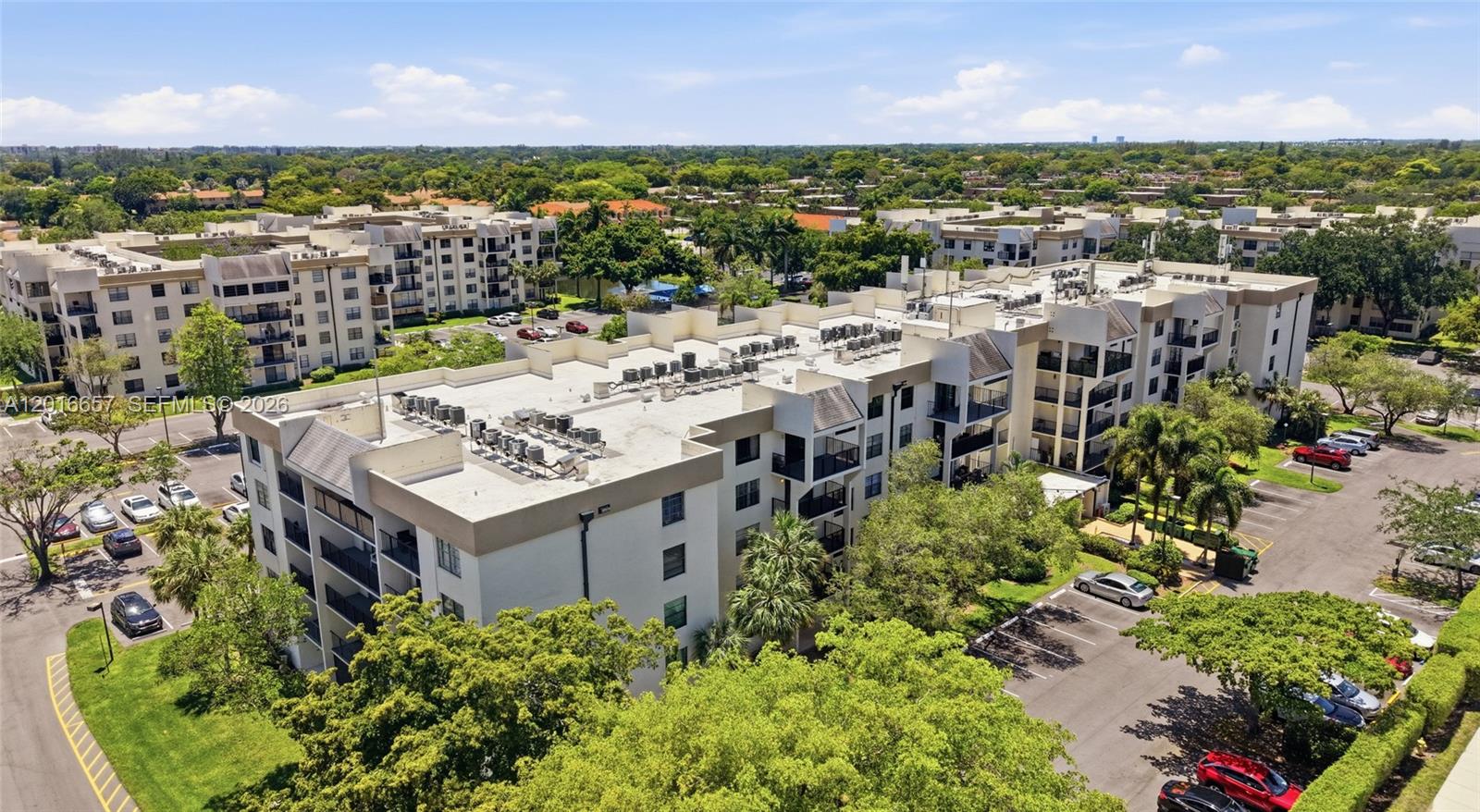 6195 Rock Island Road, Unit 511 Tamarac, FL 33319 - Photo 25 of 31 an aerial view of a house with a garden and lake view