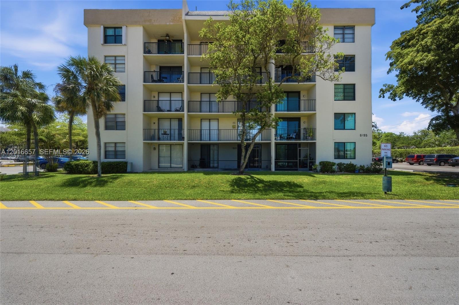 6195 Rock Island Road, Unit 511 Tamarac, FL 33319 - Photo 3 of 31 a view of a house with a yard and plants