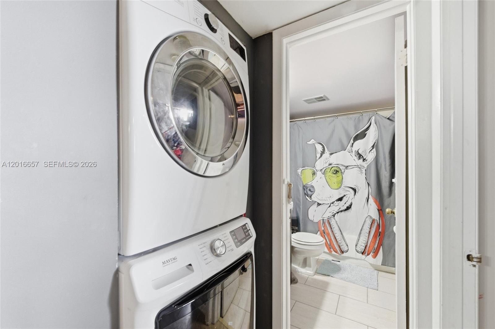 6195 Rock Island Road, Unit 511 Tamarac, FL 33319 - Photo 7 of 31 a utility room with dryer and washer