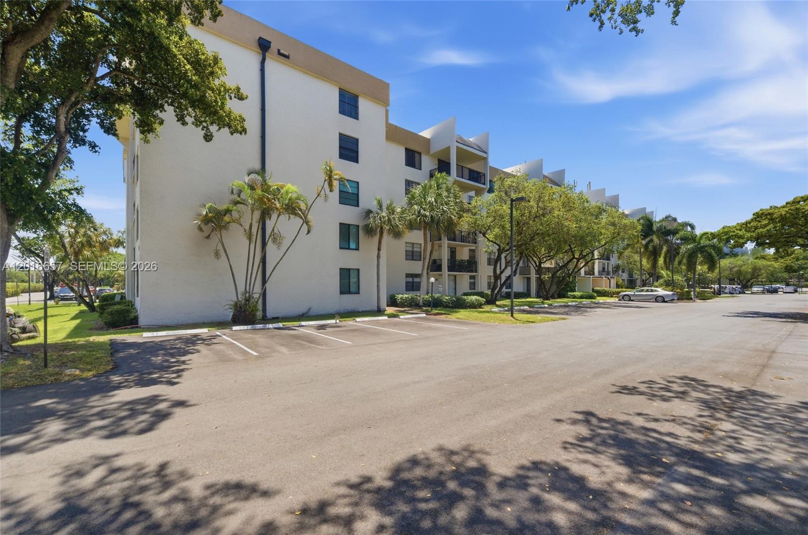 6195 Rock Island Road, Unit 511 Tamarac, FL 33319 - Photo 9 of 31 a view of a house with a yard and plant