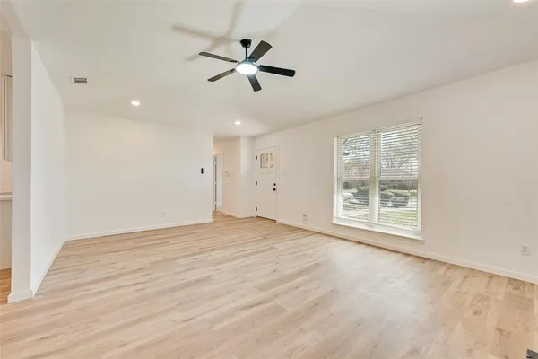 a view of an empty room with a window