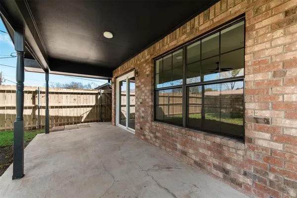 a view of an empty room with a balcony