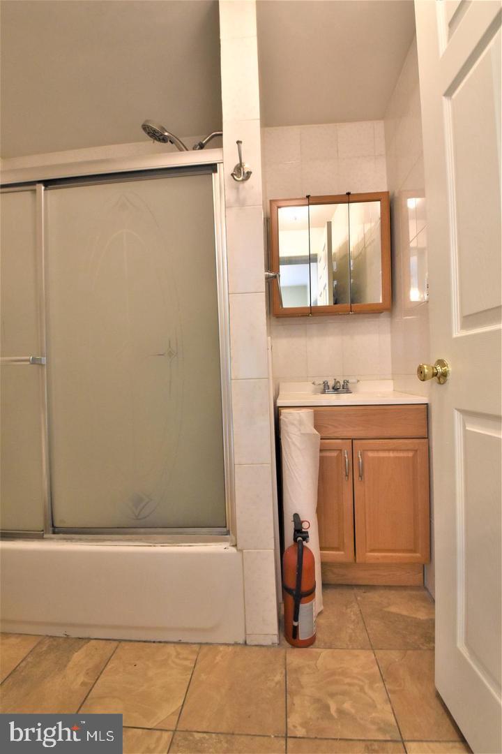 1224 Summer Street, Unit 1 Philadelphia, PA 19107 - Photo 6 of 6 a bathroom with a shower and a sink