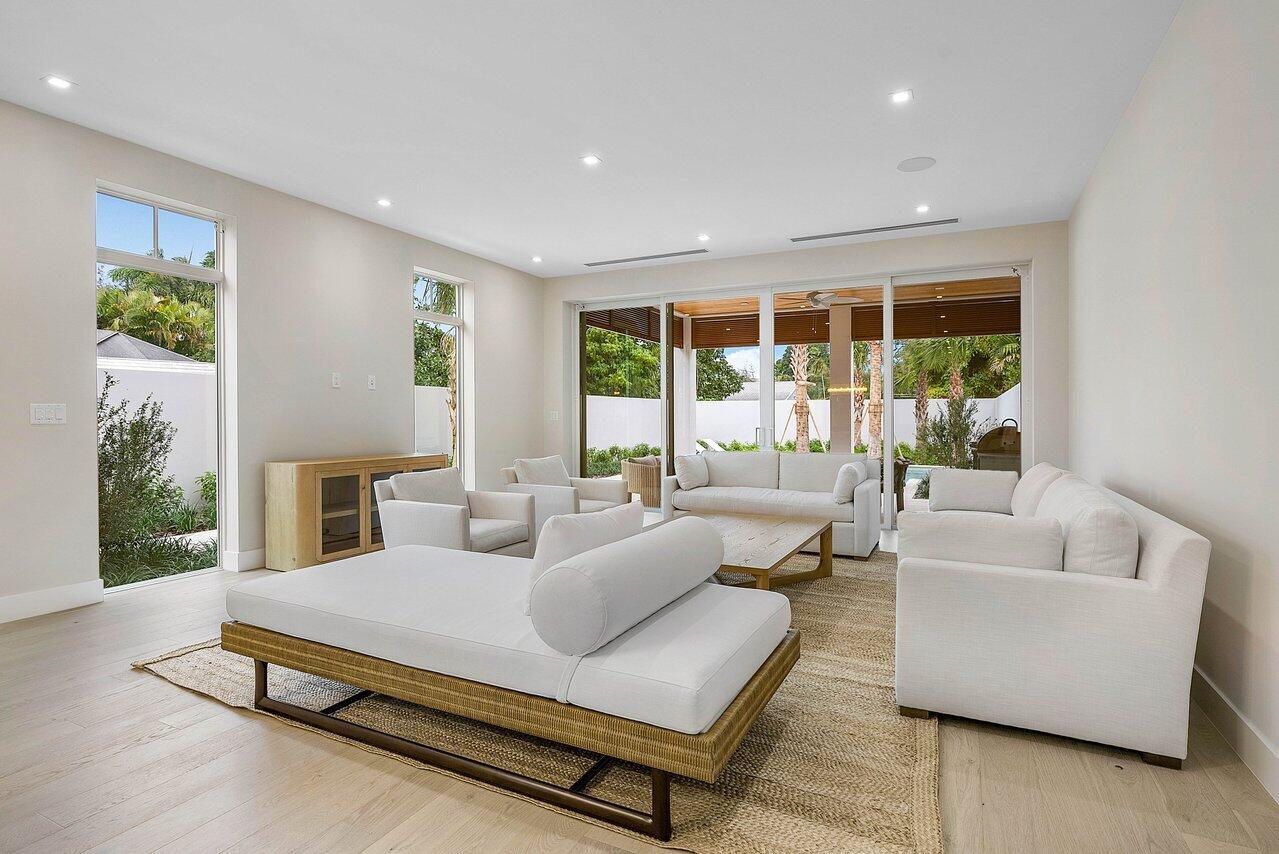 909 Bond Way Delray Beach, FL 33483 - Photo 20 of 43 a living room with furniture and a large window
