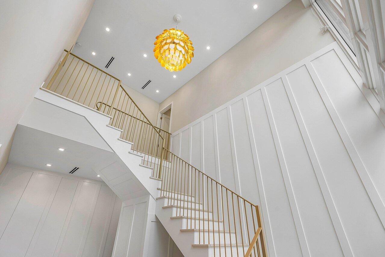 909 Bond Way Delray Beach, FL 33483 - Photo 23 of 43 a view of entryway and hall with wooden floor