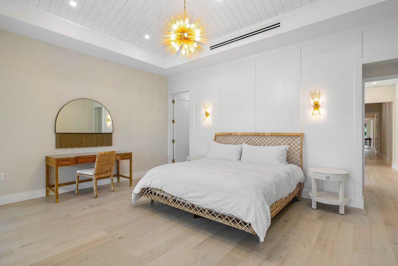 909 Bond Way Delray Beach, FL 33483 - Photo 26 of 43 a bedroom with a bed table and a chair