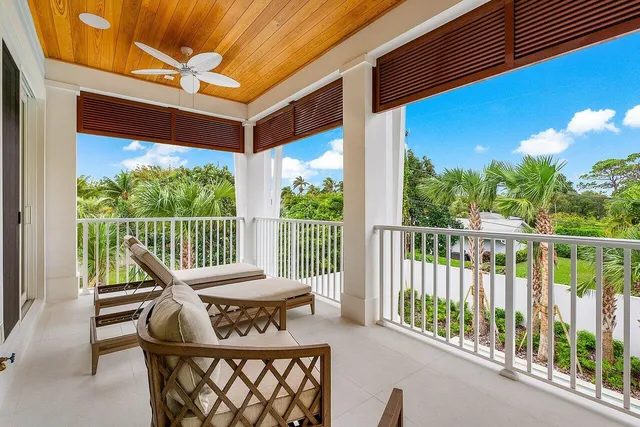 a view of a chair and table in the balcony