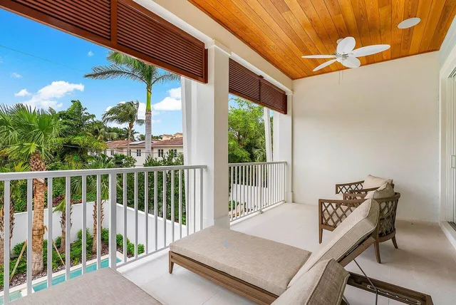 a view of a balcony with furniture