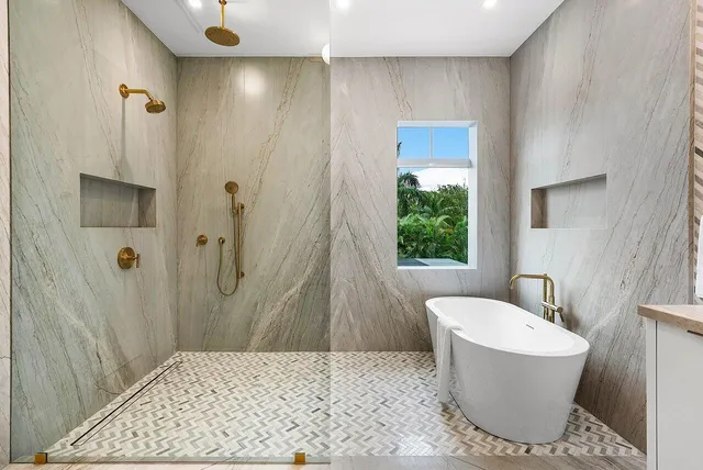 a bathroom with a bathtub and shower