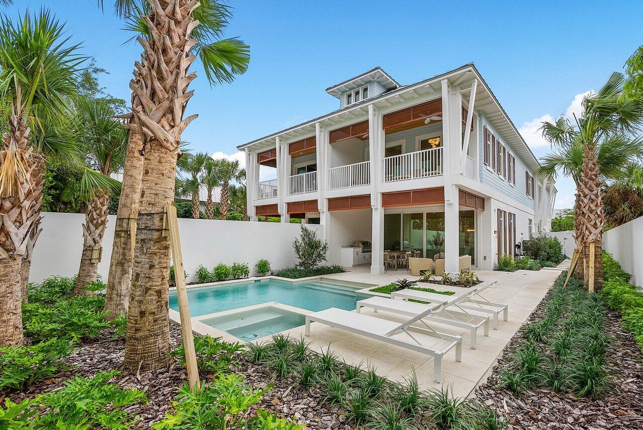 909 Bond Way Delray Beach, FL 33483 - Photo 5 of 43 a view of a building with garden and sitting area