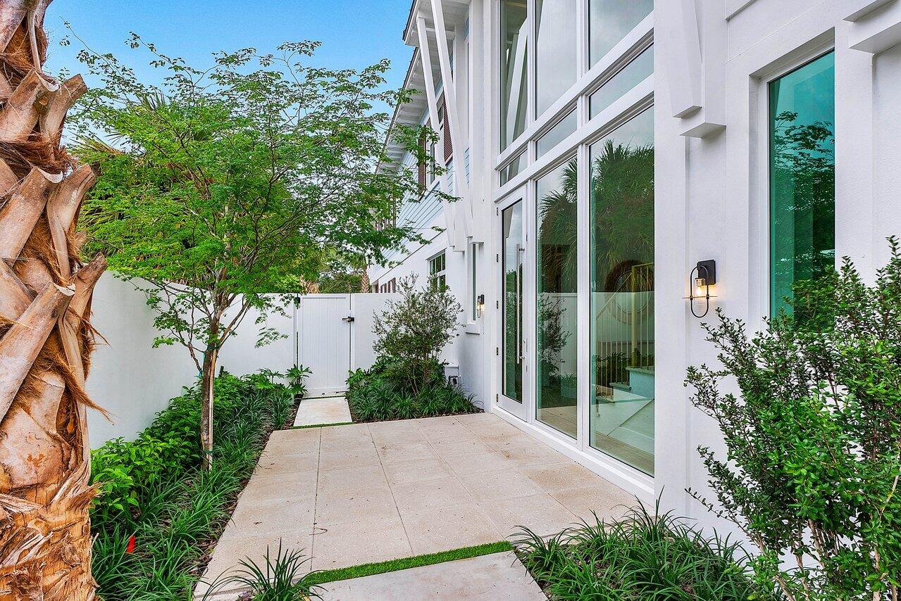 909 Bond Way Delray Beach, FL 33483 - Photo 7 of 43 a view of a garden with pathway