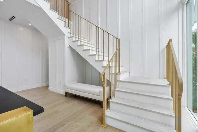 a view of entryway and hall with wooden floor