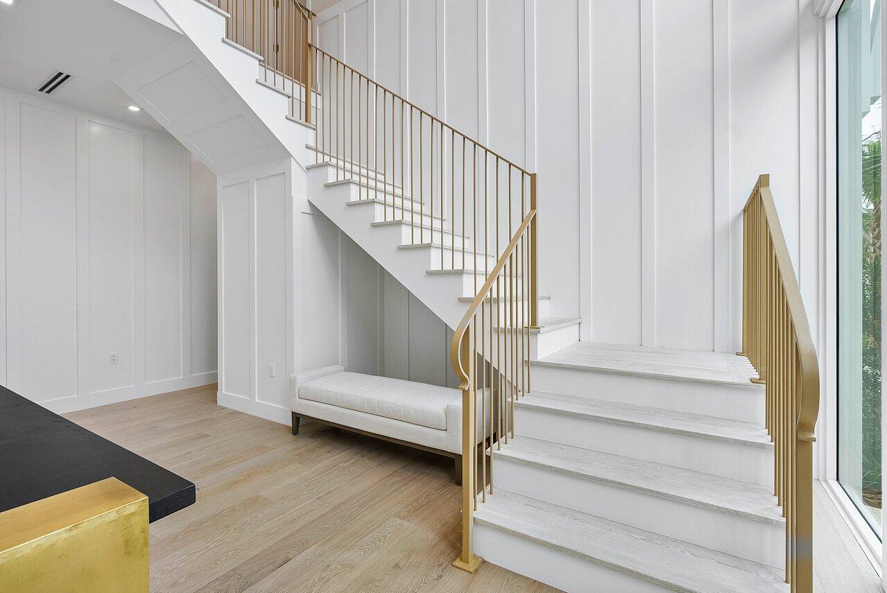 909 Bond Way Delray Beach, FL 33483 - Photo 8 of 43 a view of entryway and hall with wooden floor
