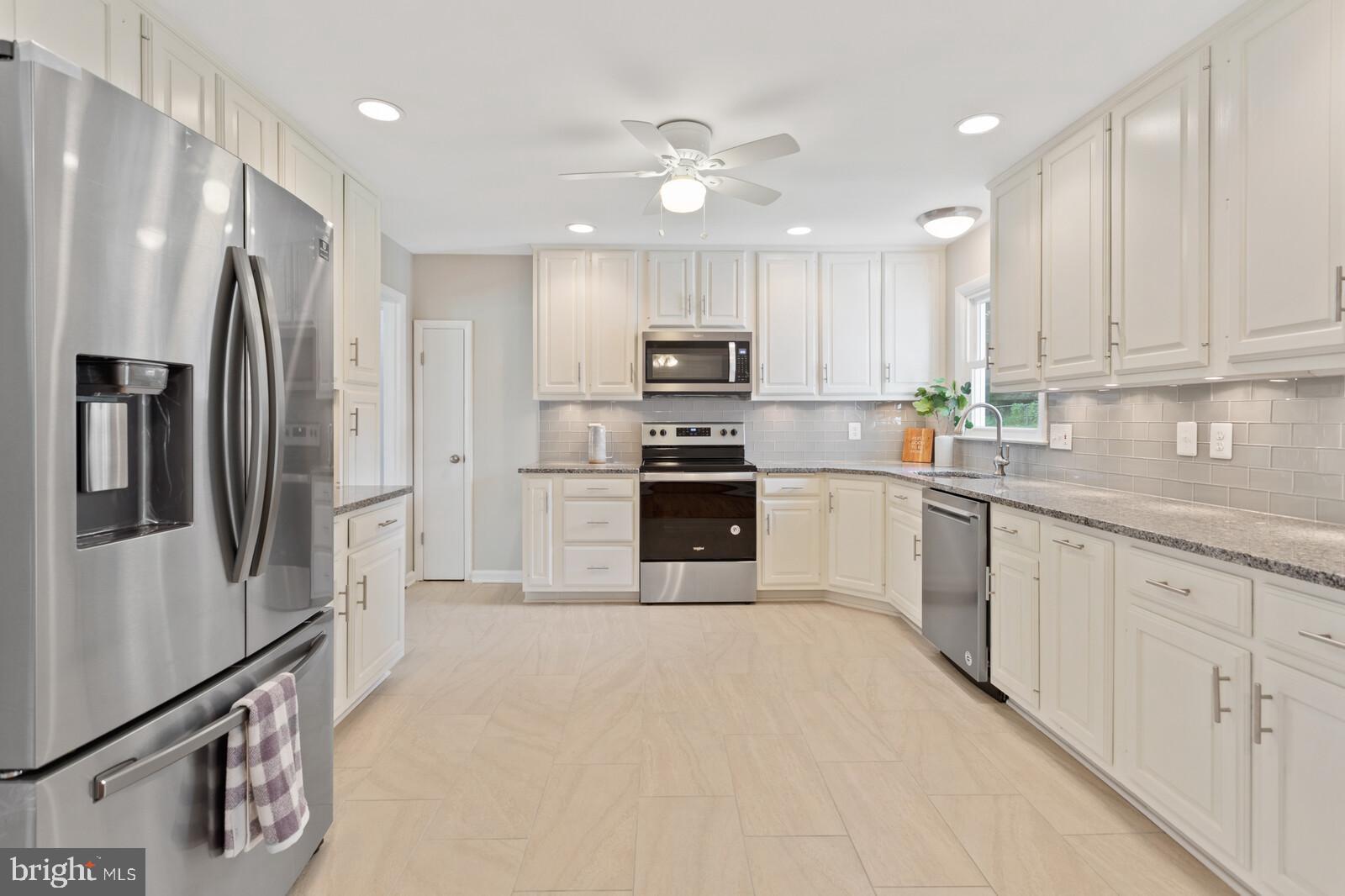 7021 Hadlow Drive Springfield, VA 22152 - Photo 1 of 47 Granite Counters, Subway Tile Backsplash