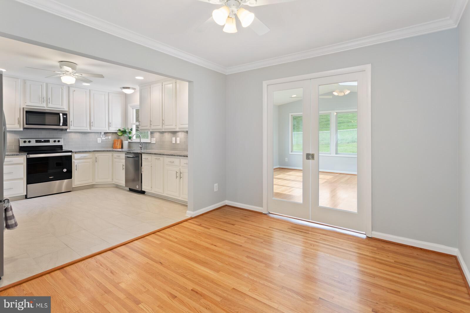 7021 Hadlow Drive Springfield, VA 22152 - Photo 7 of 47 Dining Room Leads into Sunroom and Open to Kitchen