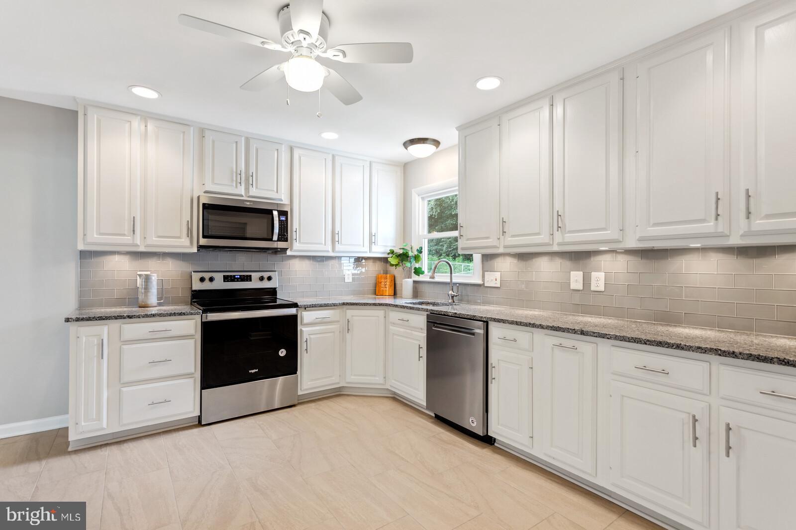 7021 Hadlow Drive Springfield, VA 22152 - Photo 10 of 47 Gorgeous Porcelain Tile Floors, Recessed Lighting