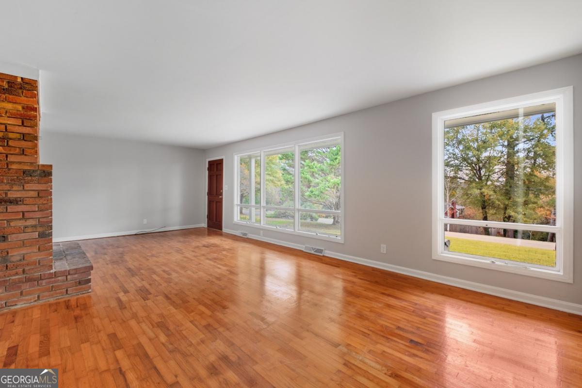 14 Mitchell Circle Rome, GA 30161 - Photo 24 of 39 a view of an empty room with wooden floor and a window
