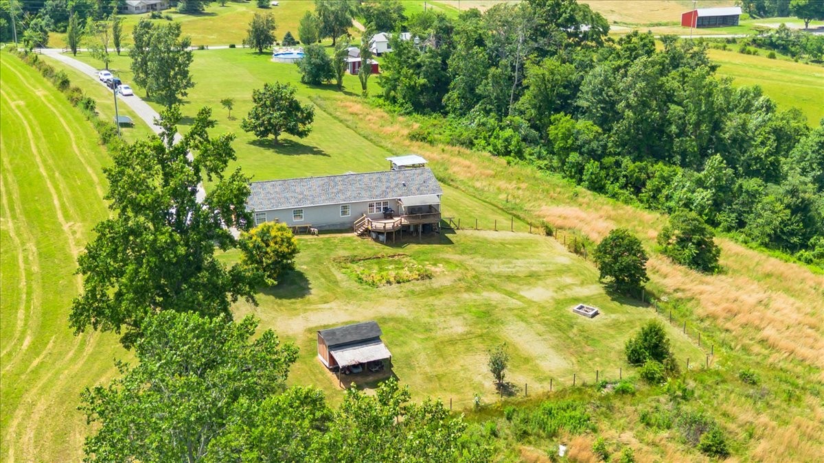 2657 Oak Grove Road Red Boiling Springs, TN 37150 - Photo 42 of 45 a view of a yard with plants and large trees