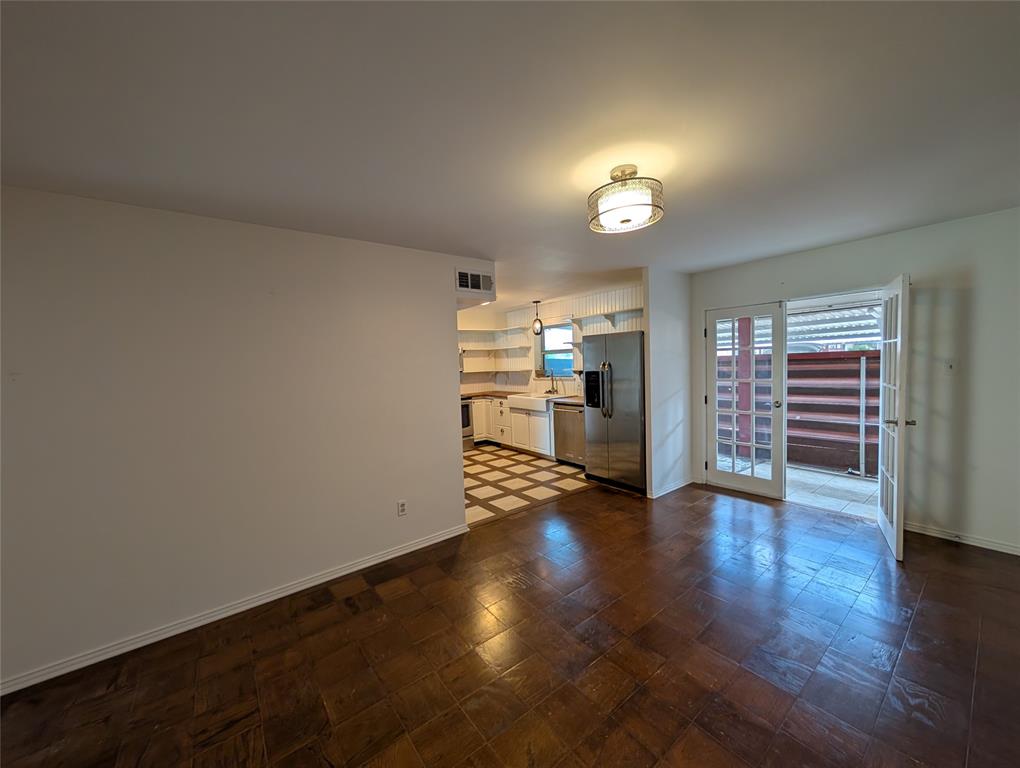 4715 Skillman Street, Unit A Dallas, TX 75206 - Photo 11 of 28 Open concept living space featuring dark tile flooring