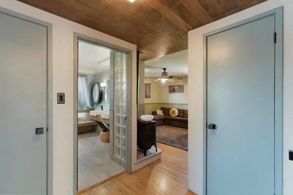 a en suite bathroom with a glass door shower and a sink
