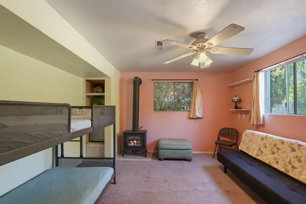 a bedroom with furniture and a chandelier