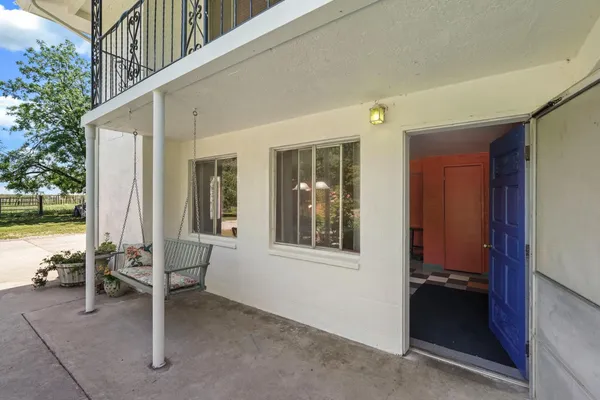 a view of backyard with outdoor seating space