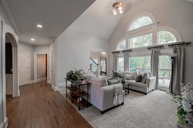 a living room with furniture a window and a fireplace