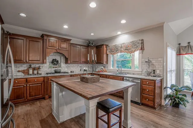 a kitchen with granite countertop a sink and stove