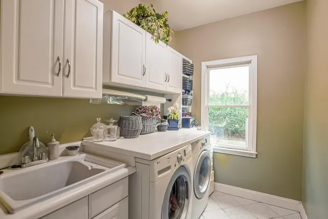 a bathroom with a sink a toilet and shower curtain