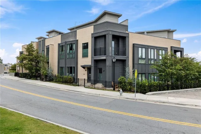 a kitchen with a table chairs stove and cabinets