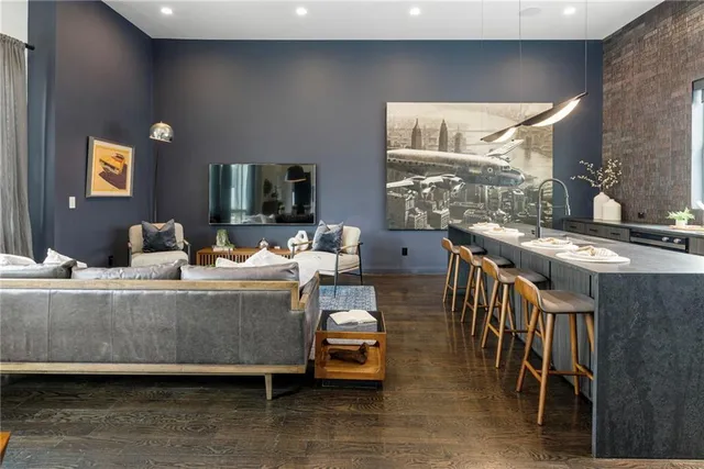 a living room with furniture and a flat screen tv